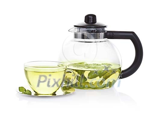 Isolated teapot and a cup of peppermint tea Isolated teapot and a cup of peppermint tea