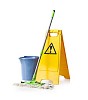 Isolated bucket with a mop and a wet floor sign