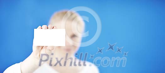 Woman on a blue background showing a blank card Woman on a blue background showing a blank card
