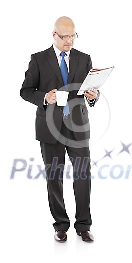 Isolated businessman reading a newspaper and drinking coffee Isolated businessman reading a newspaper and drinking coffee