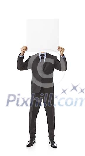 Isolated businessman hiding his face behind a blank paper Isolated businessman hiding his face behind a blank paper