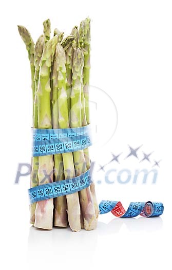 Isolated bunch of asparagus with a tapeline around it Isolated bunch of asparagus with a tapeline around it