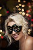 Masked woman on a lighted background