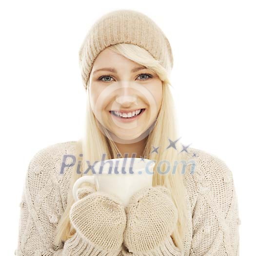 Woman in winter clothing holding a cup Woman in winter clothing holding a cup