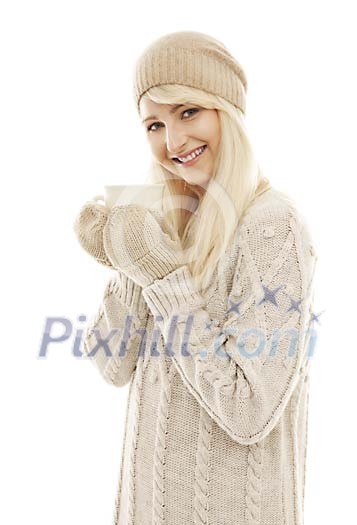 Woman in sweater holding a coffee cup Woman in sweater holding a coffee cup
