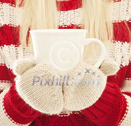 Female holding a cup Female holding a cup