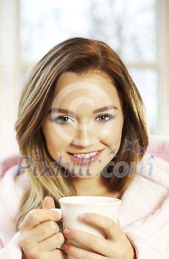 Woman having a cup of coffee in the morning Woman having a cup of coffee in the morning