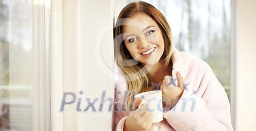 Woman having a cup of tea in the morning