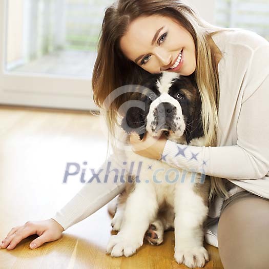 Woman hugging a puppy Woman hugging a puppy