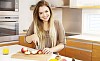 Woman cutting apples in the kitchen