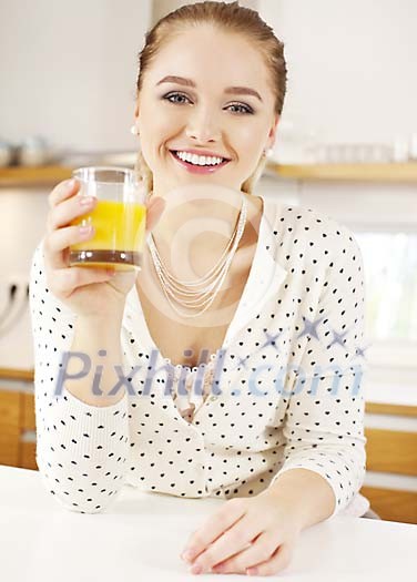 Woman having a glass of juice Woman having a glass of juice