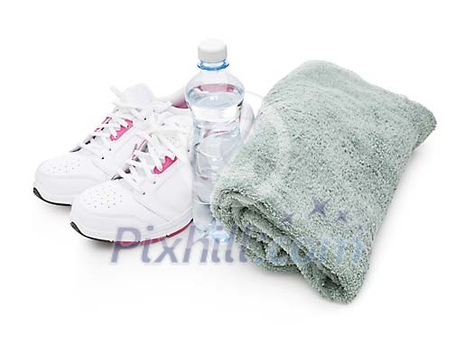 Isolated running shoes with a bottle of water and a towel Isolated running shoes with a bottle of water and a towel