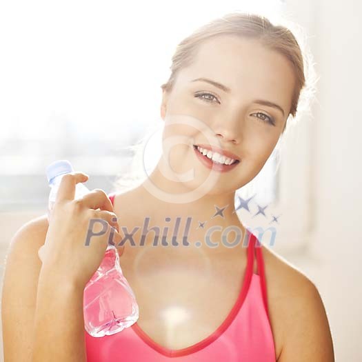 Female holding a water bottle Female holding a water bottle