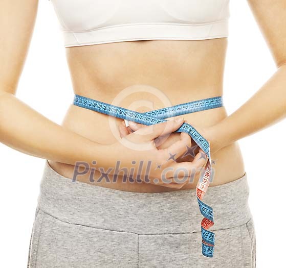 Female measuring her waist Female measuring her waist