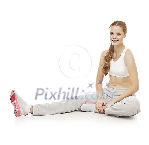 Isolated female stretching on the floor Isolated female stretching on the floor