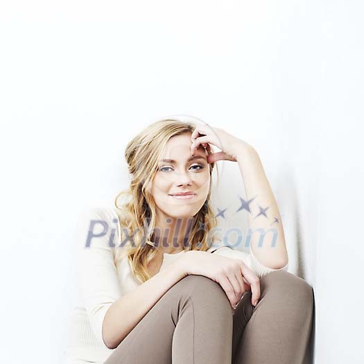 Woman sitting in the corner Woman sitting in the corner