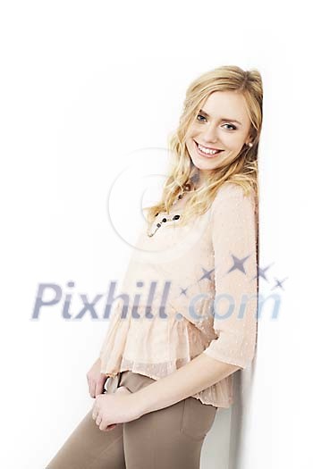 Woman leaning to the wall and smiling Woman leaning to the wall and smiling
