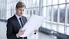 Businessman looking at the blueprint