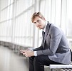 Young businessman sitting in the hall