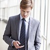 Businessman looking at his phone