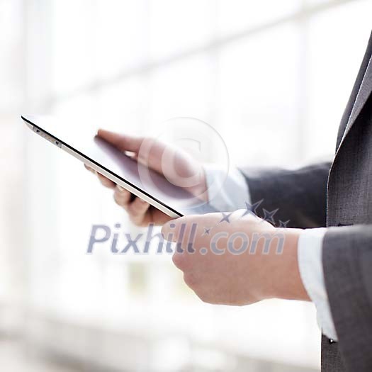 Businessman holding a tablet computer Businessman holding a tablet computer