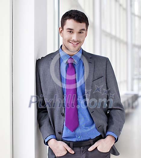 Good looking businessman standing Good looking businessman standing