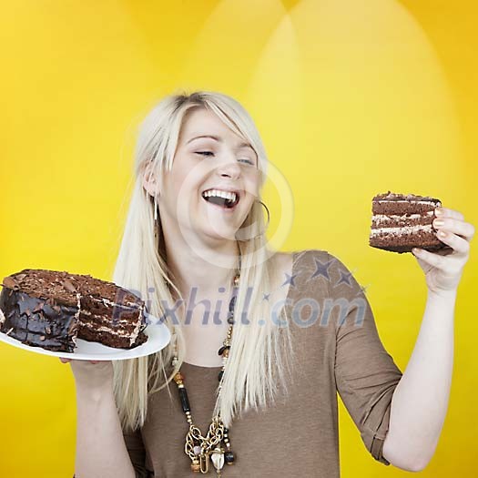 Smiling woman with a chocolate cake Smiling woman with a chocolate cake