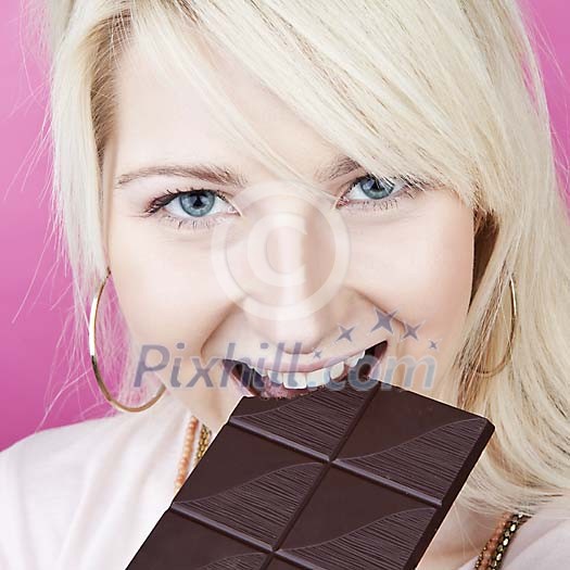 Woman eating chocolate Woman eating chocolate