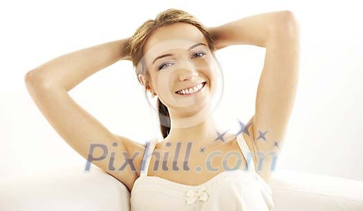 Relaxing woman sitting on the sofa Relaxing woman sitting on the sofa