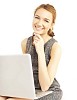 Smiling woman with a laptop