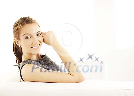 Smiling woman on the sofa Smiling woman on the sofa