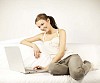 Woman sitting on the sofa with laptop