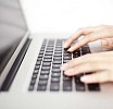 Female hands on a keyboard