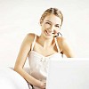 Smiling woman with a laptop