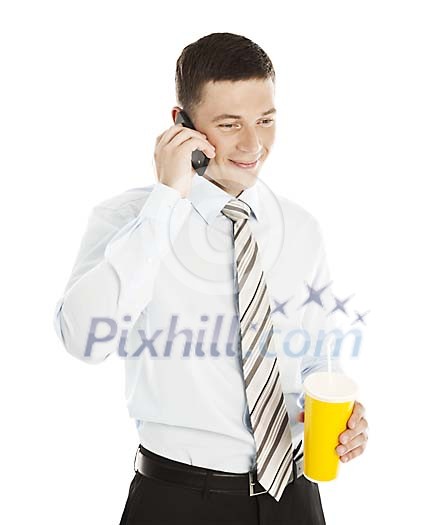 Isolated businessman talking to the phone and holding a juice cup Isolated businessman talking to the phone and holding a juice cup