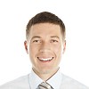 Isolated smiling businessmans face