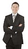 Isolated businessman standing and smiling