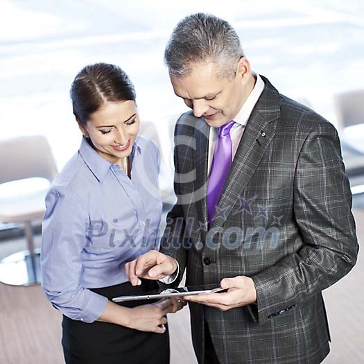 Business people with a tablet computer Business people with a tablet computer