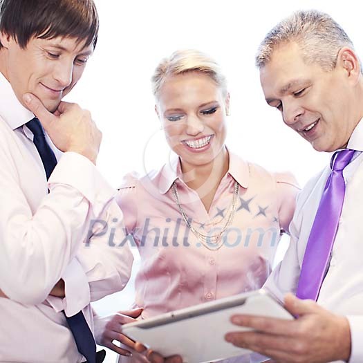 Businessman showing his tablet computer to his co-workers Businessman showing his tablet computer to his co-workers