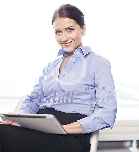 Businesswoman sitting in the office Businesswoman sitting in the office