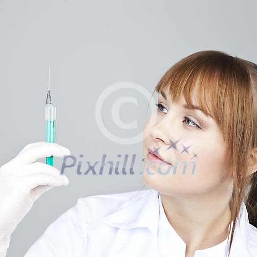Female nurse with a syringe Female nurse with a syringe