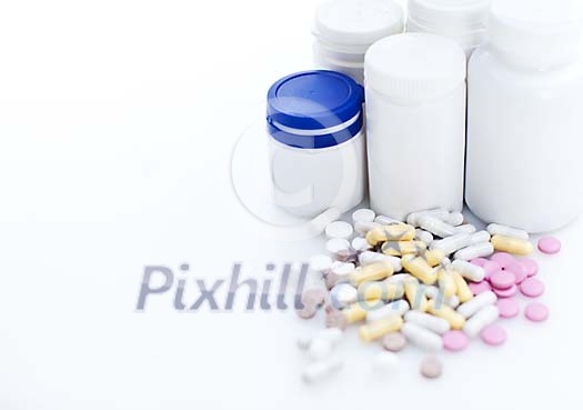 Medicine jars with different coloured pills Medicine jars with different coloured pills