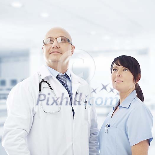 Proud male doctor and female nurse Proud male doctor and female nurse