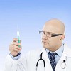 Male doctor with a syringe