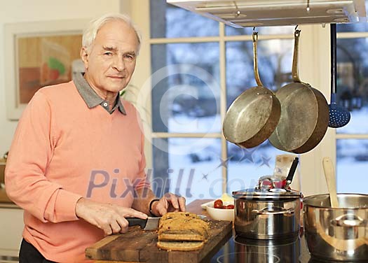 Senior male cooking in the kitchen Senior male cooking in the kitchen