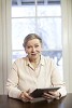 Senior woman at home holding iPad