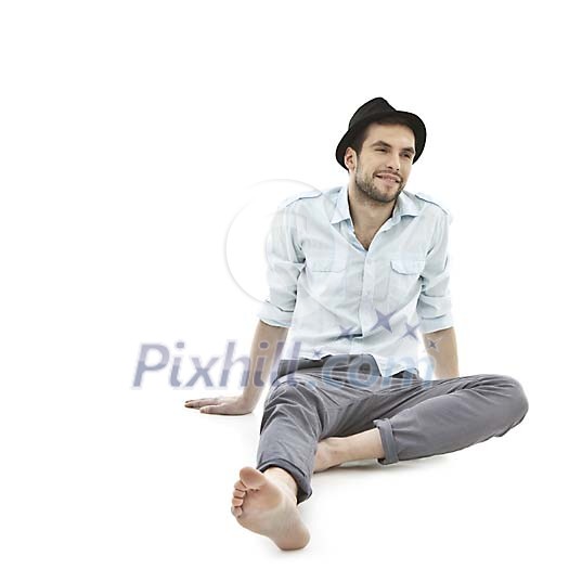 Isolated man sitting on the floor Isolated man sitting on the floor