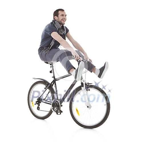 Isolated man doing a trick on the bicycle Isolated man doing a trick on the bicycle