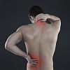 Man touching his sore neck and back