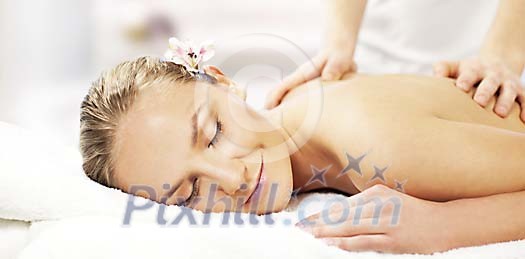 Woman enjoying a massage Woman enjoying a massage